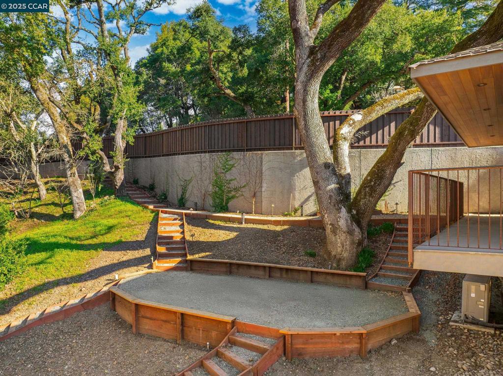 100 Moraga Way Orinda, CA 94563 - Photo 47 of 48 a view of a house with backyard and a sitting area
