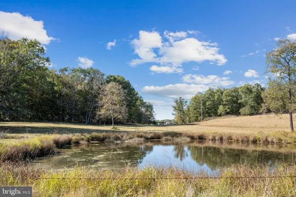 a view of a lake with a big yard