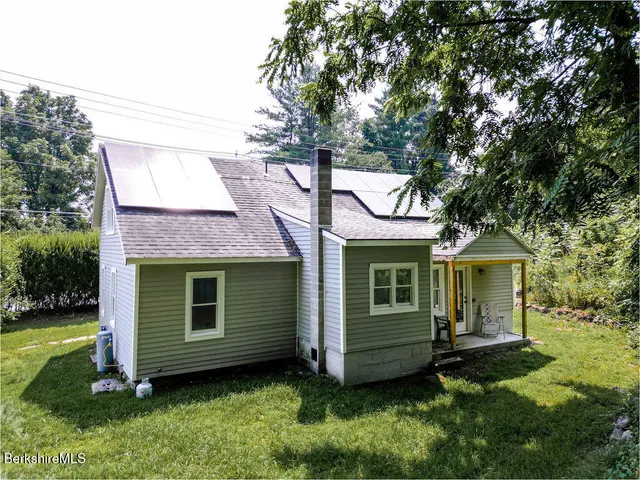 a view of a house with a sink and a yard