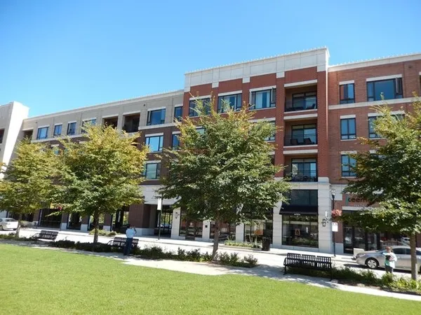 a front view of building with yard
