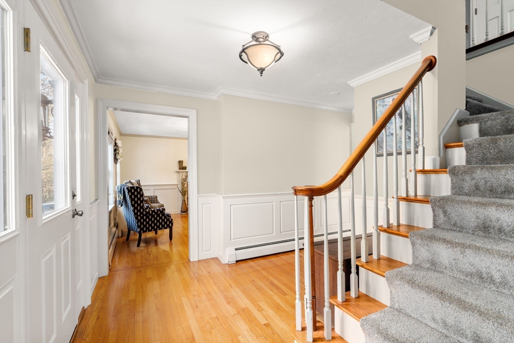 62 Allen Road Sturbridge, MA 01566 - Photo 18 of 41 a view of a hallway with wooden floor and staircase