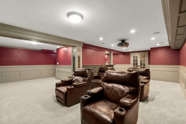 a media room with lots of chairs and a projector screen