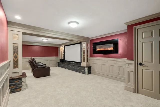 a hallway with a couch and a flat screen tv