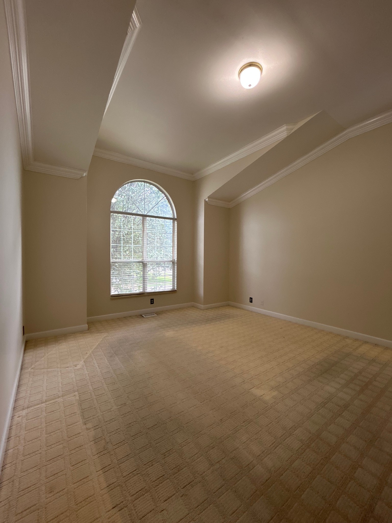 322 Logans Circle Franklin, TN 37067 - Photo 20 of 27 an empty room with a chandelier fan and windows
