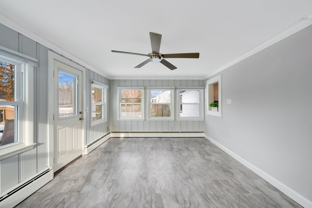 6 Cornwall Street Springfield, MA 01104 - Photo 12 of 40 a view of an empty room with a window and wooden floor