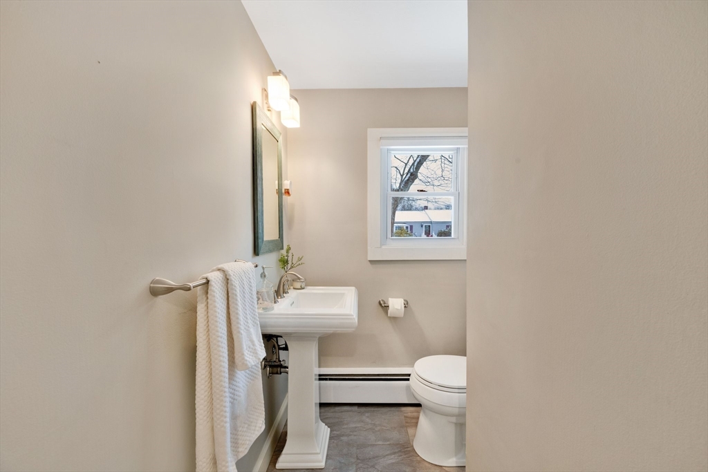 6 Cornwall Street Springfield, MA 01104 - Photo 24 of 40 a bathroom with a toilet a sink and mirror