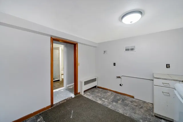a view of a storage & utility room with closet