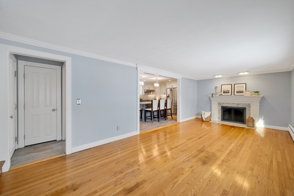 6 Cornwall Street Springfield, MA 01104 - Photo 4 of 40 a view of empty room with wooden floor and fireplace