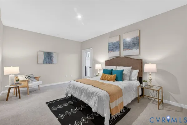 a bedroom with a bed and a lamp on table