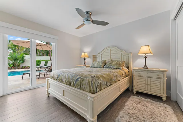 a bed room with a bed and a chandelier