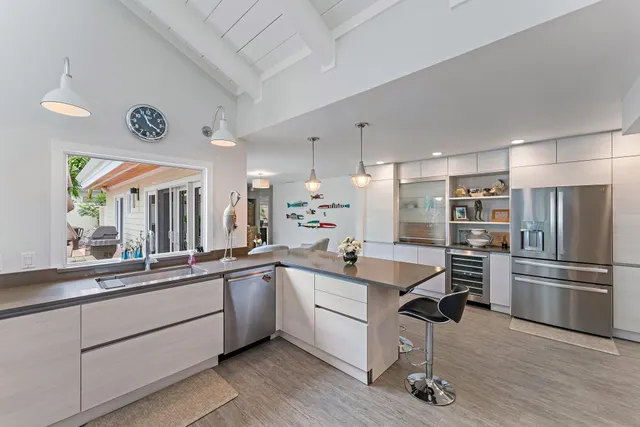 a kitchen with counter top space and stainless steel appliances