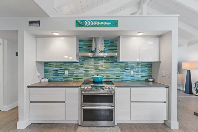 a kitchen with stainless steel appliances granite countertop a stove and a cabinets