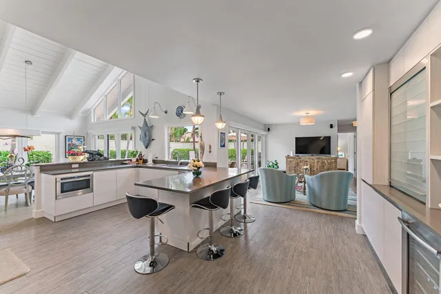 a kitchen with a table and chairs in it