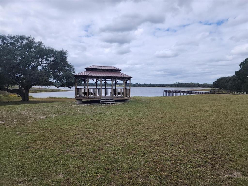 649 Southwest Winding Hills Road Dunnellon, FL 34431 - Photo 8 of 26 a view of a large body of water with a building in the background