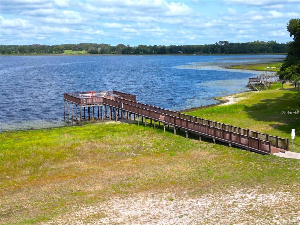 649 Southwest Winding Hills Road Dunnellon, FL 34431 - Photo 9 of 26 a view of a lake with houses in the back