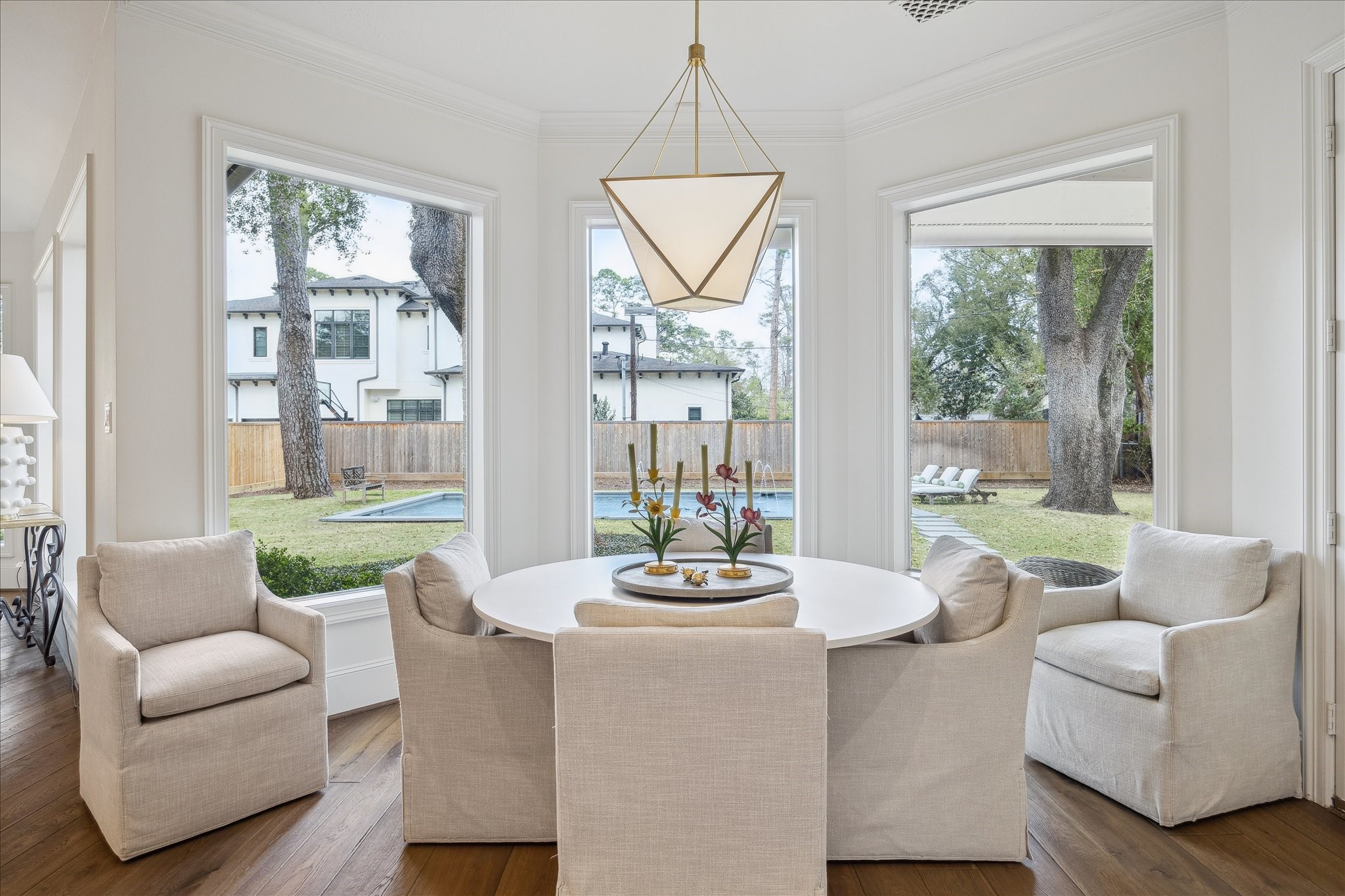 11524 Taylorcrest Road Houston, TX 77024 - Photo 17 of 47 Another view of the breakfast room highlighting the art deco French Lorino Lantern and the unobstructed views of the backyard.