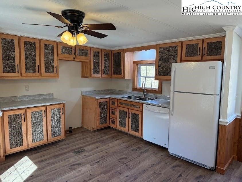 388 Monroe Miller Road Lansing, NC 28643 - Photo 11 of 34 a kitchen with stainless steel appliances granite countertop a refrigerator a stove a sink and a microwave