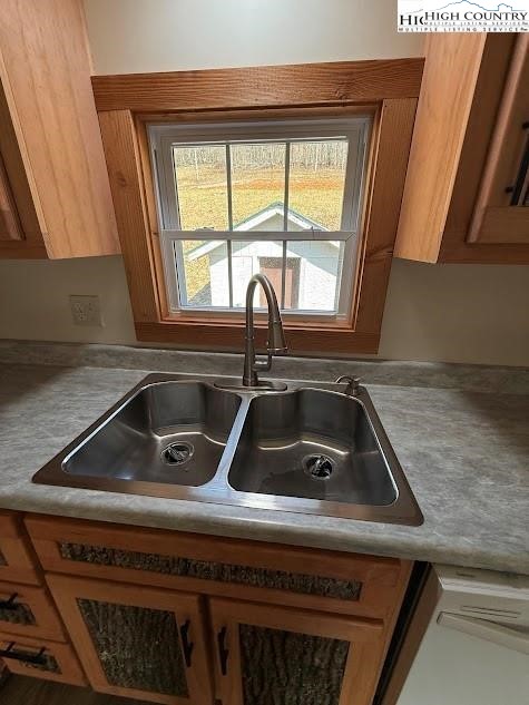 388 Monroe Miller Road Lansing, NC 28643 - Photo 12 of 34 a kitchen sink sitting next to a window
