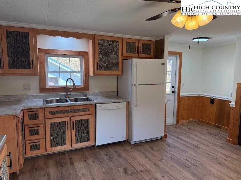 388 Monroe Miller Road Lansing, NC 28643 - Photo 13 of 34 a kitchen with stainless steel appliances granite countertop a refrigerator a sink a stove and a wooden floors