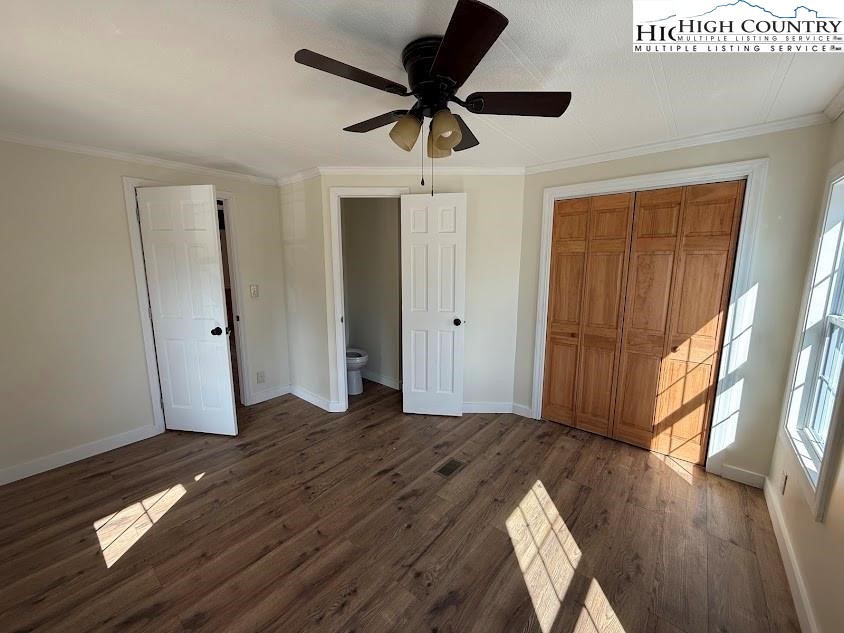 388 Monroe Miller Road Lansing, NC 28643 - Photo 24 of 34 a view of empty room with wooden floor and fan