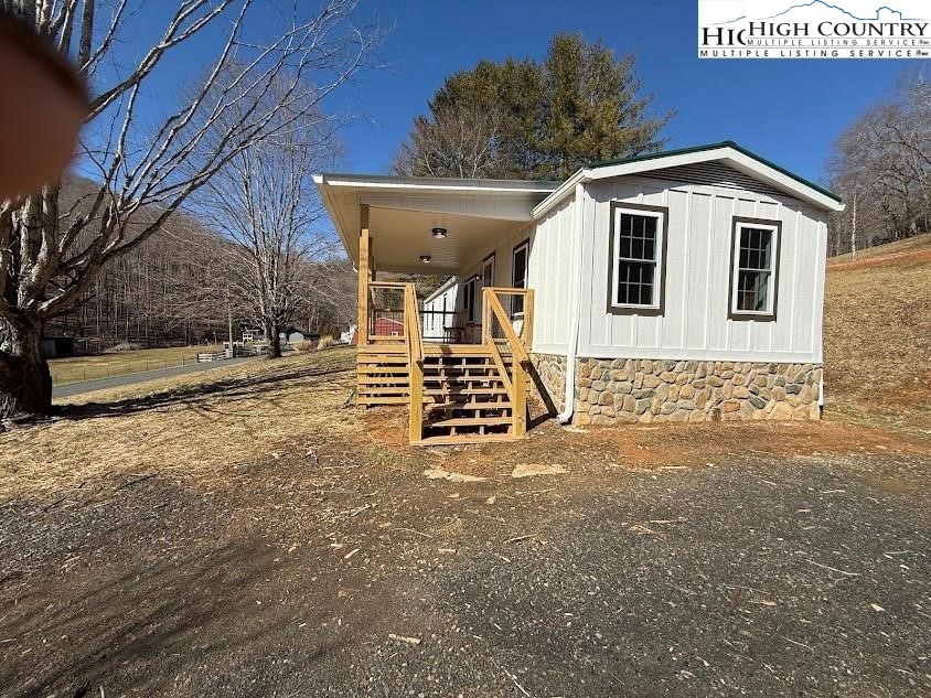 388 Monroe Miller Road Lansing, NC 28643 - Photo 32 of 34 a front view of a house with a yard