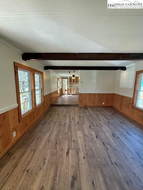 388 Monroe Miller Road Lansing, NC 28643 - Photo 8 of 34 a view of empty room with wooden floor and fan
