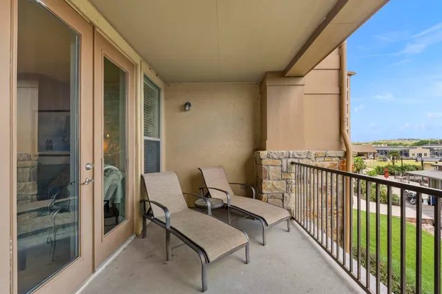 a view of balcony with furniture