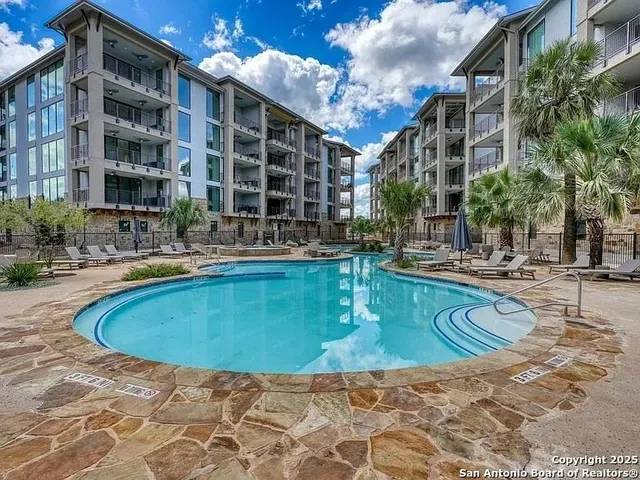 a view of pool with outdoor seating