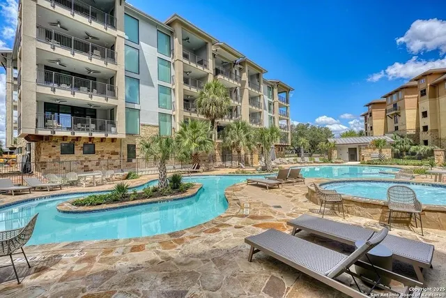 a view of a swimming pool with a lounge chairs