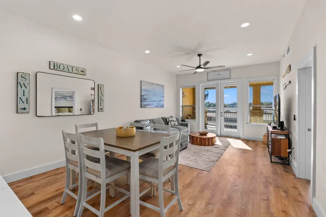 a view of a dining room with furniture window and wooden floor