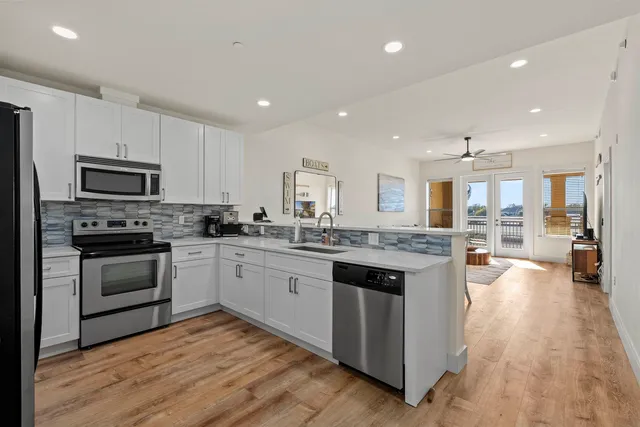 a large kitchen with cabinets