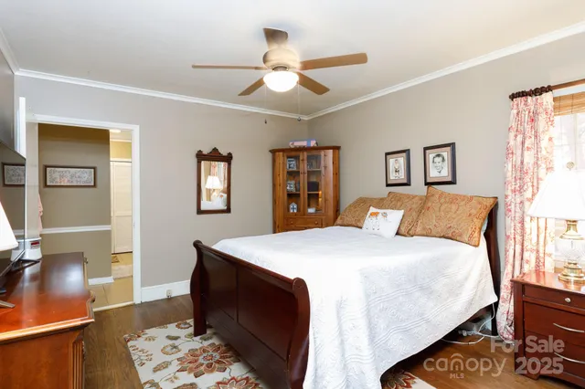 a bed room with a bed and a dresser