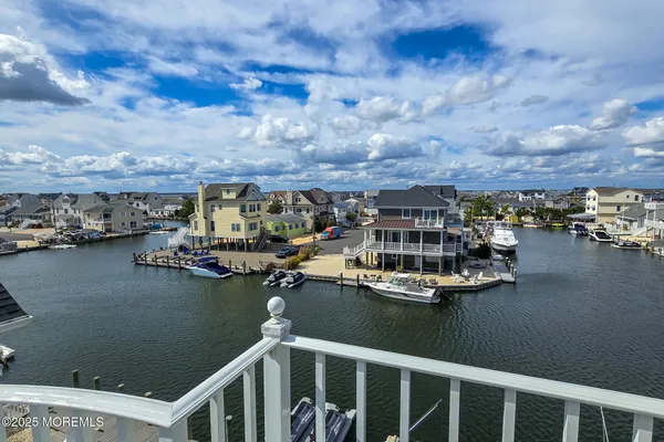 an aerial view of a houses with ocean view