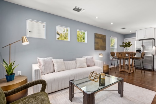 1183 Coleto Street Austin, TX 78702 - Photo 6 of 17 a living room with furniture and wooden floor