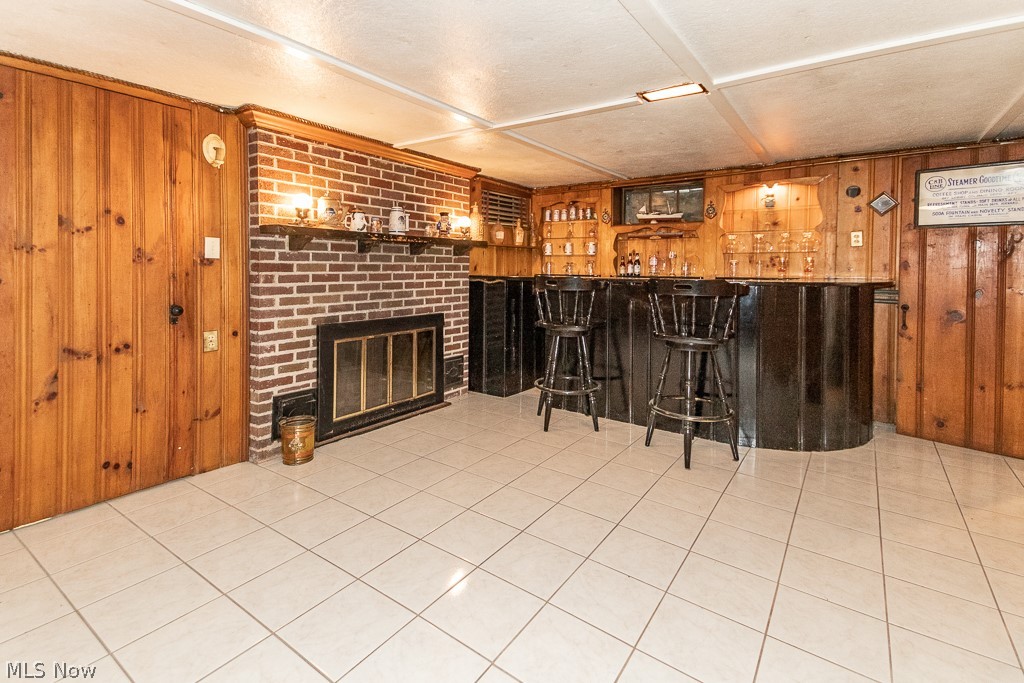 38557 Beachview Road Willoughby, OH 44094 - Photo 21 of 31 Lower level recreation room with bar and fireplace