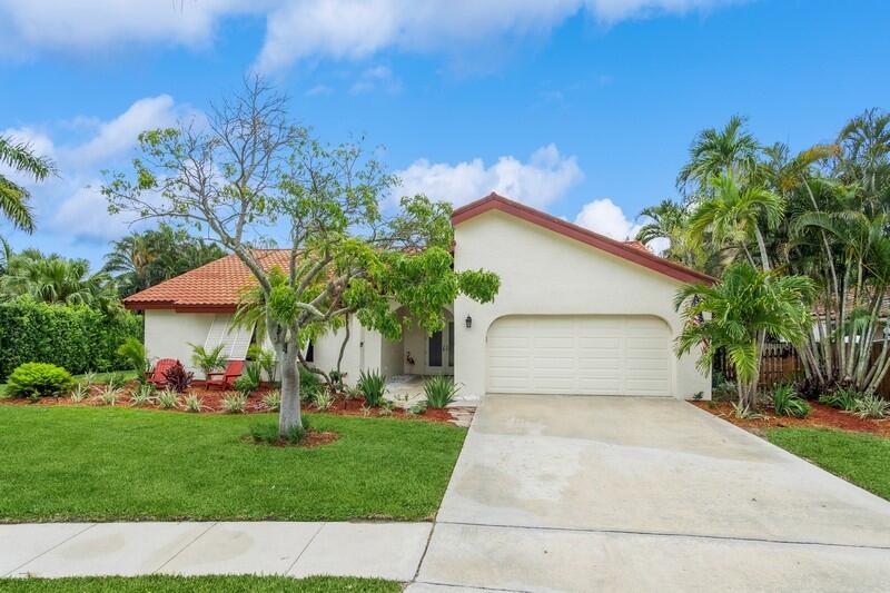 403 Northwest 72nd Street Boca Raton, FL 33487 - Photo 3 of 35 02_403NW72ndSt_57_FrontView_FlexMLS800x6