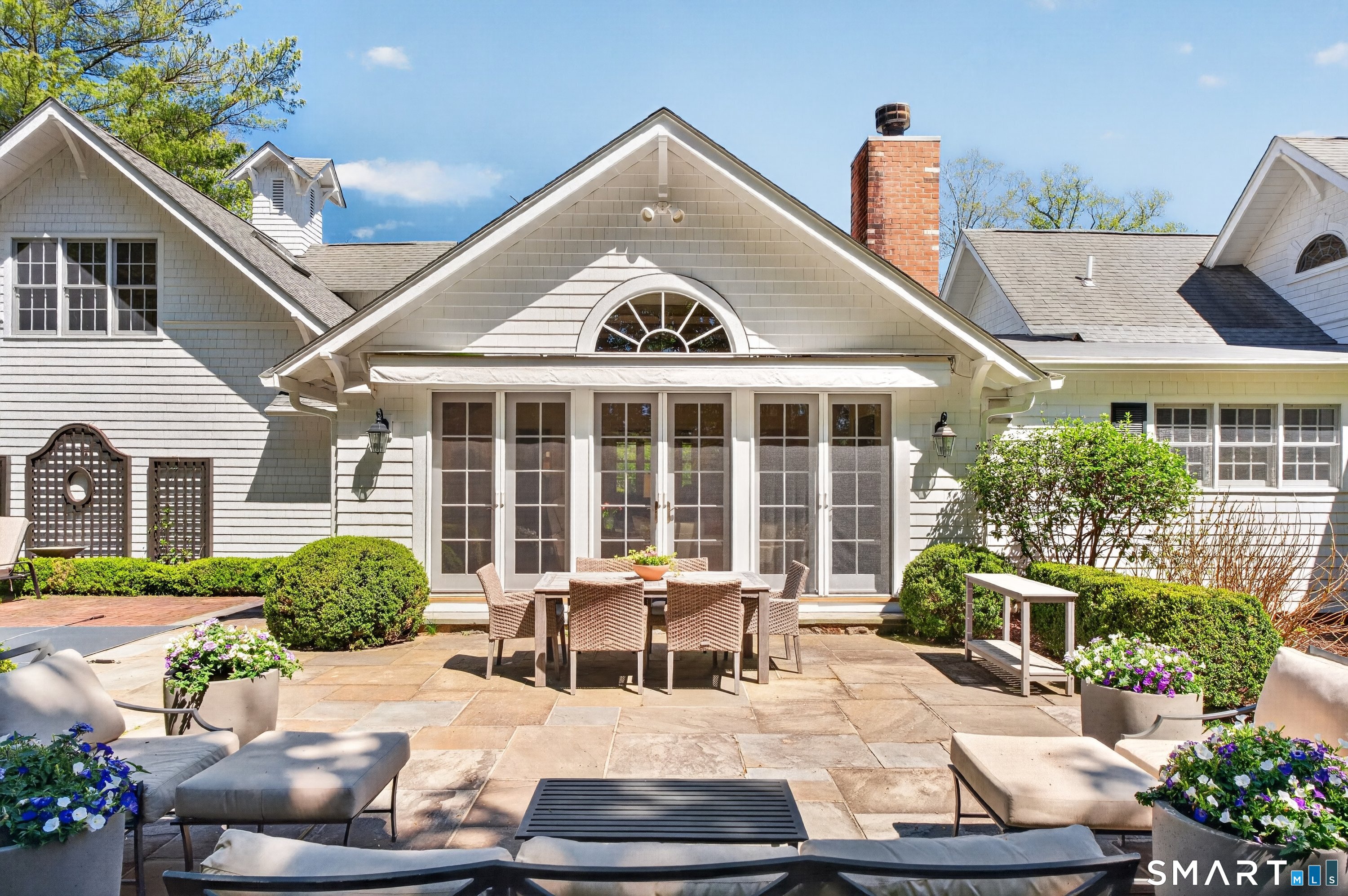 41 Peaceable Street Ridgefield, CT 06877 - Photo 33 of 40 a house view with a sitting space garden and outdoor seating