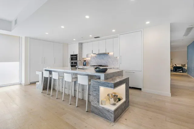 a spacious bedroom with a bed and walk in closet