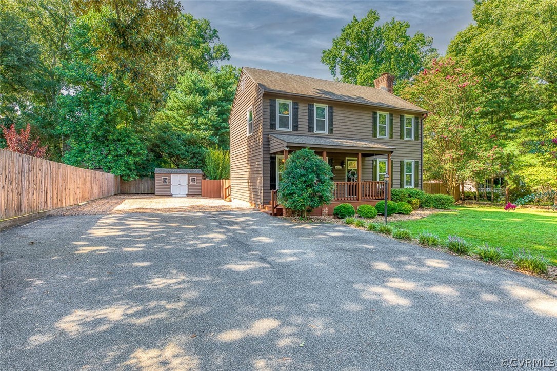 10518 Surry Road Chester, VA 23831 - Photo 3 of 26 a view of a house with yard and a garden