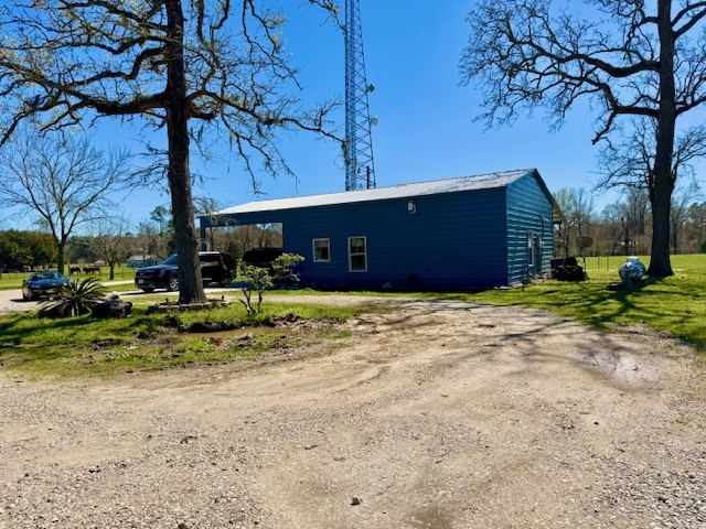 59 Private Road Dayton, TX 77535 - Photo 1 of 13 a front view of a house with a yard