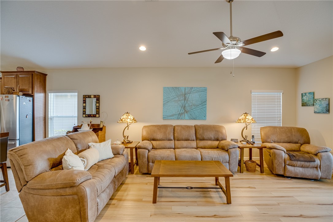 2965 Louetta Circle Melbourne, FL 32901 - Photo 15 of 36 a living room with furniture and a wooden floor