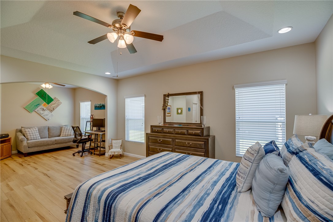 2965 Louetta Circle Melbourne, FL 32901 - Photo 20 of 36 a bedroom with a bed and furniture