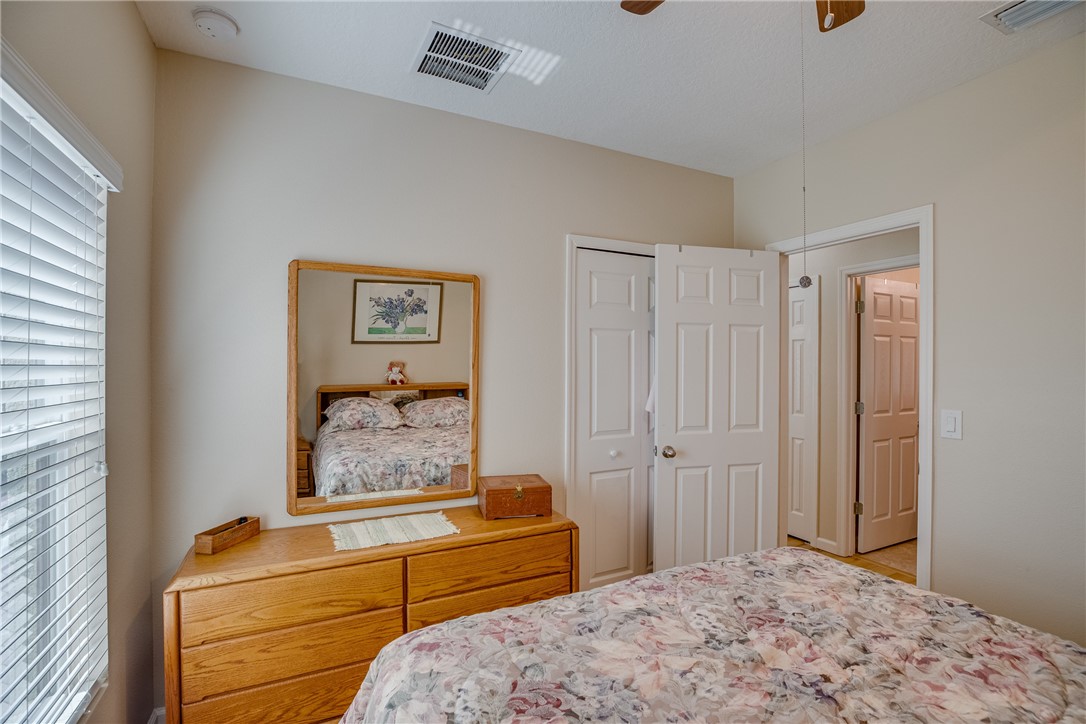 2965 Louetta Circle Melbourne, FL 32901 - Photo 26 of 36 a bedroom with a bed and painting on the wall