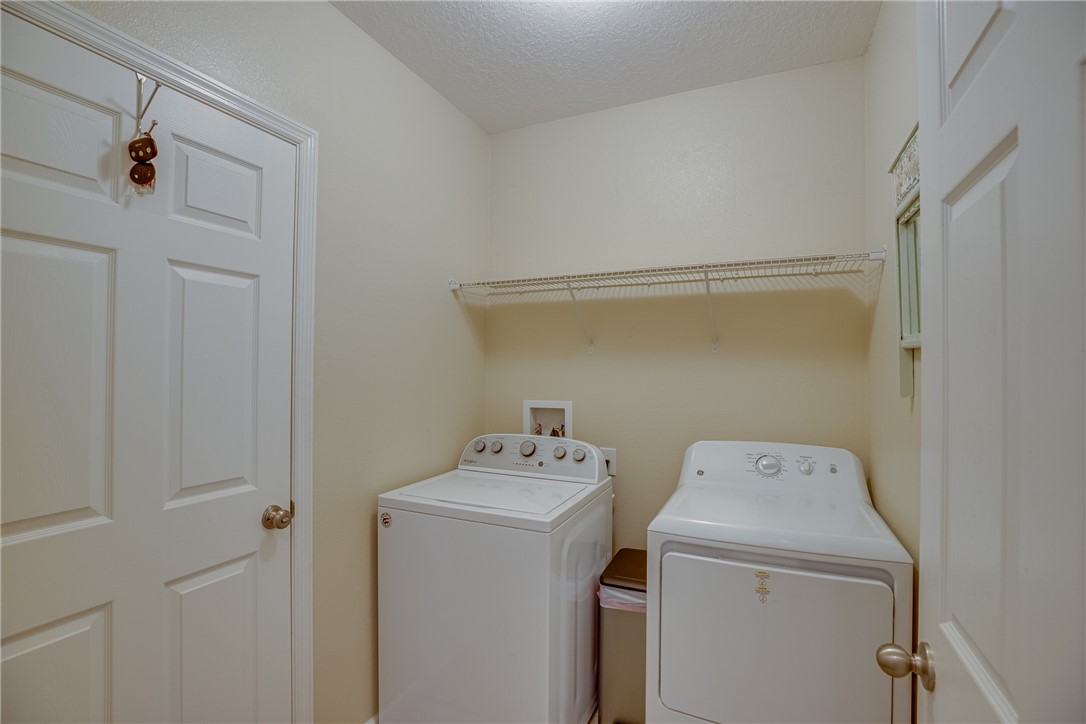2965 Louetta Circle Melbourne, FL 32901 - Photo 31 of 36 a utility room with dryer and washer