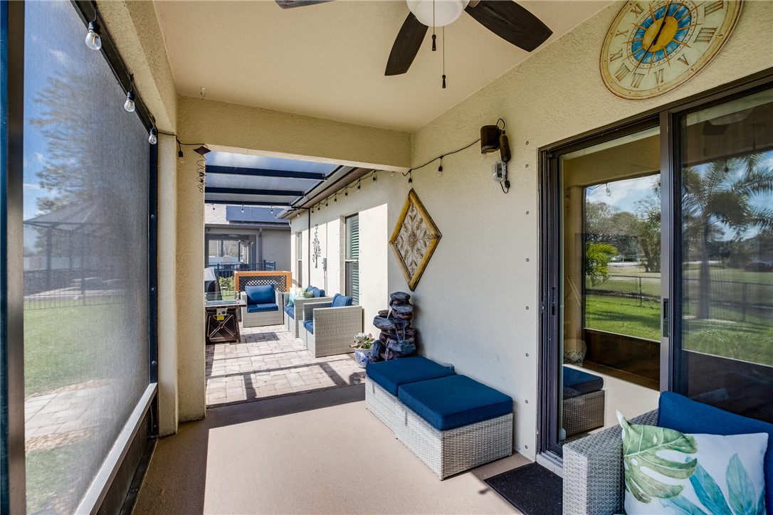2965 Louetta Circle Melbourne, FL 32901 - Photo 32 of 36 a living room with furniture and a floor to ceiling window
