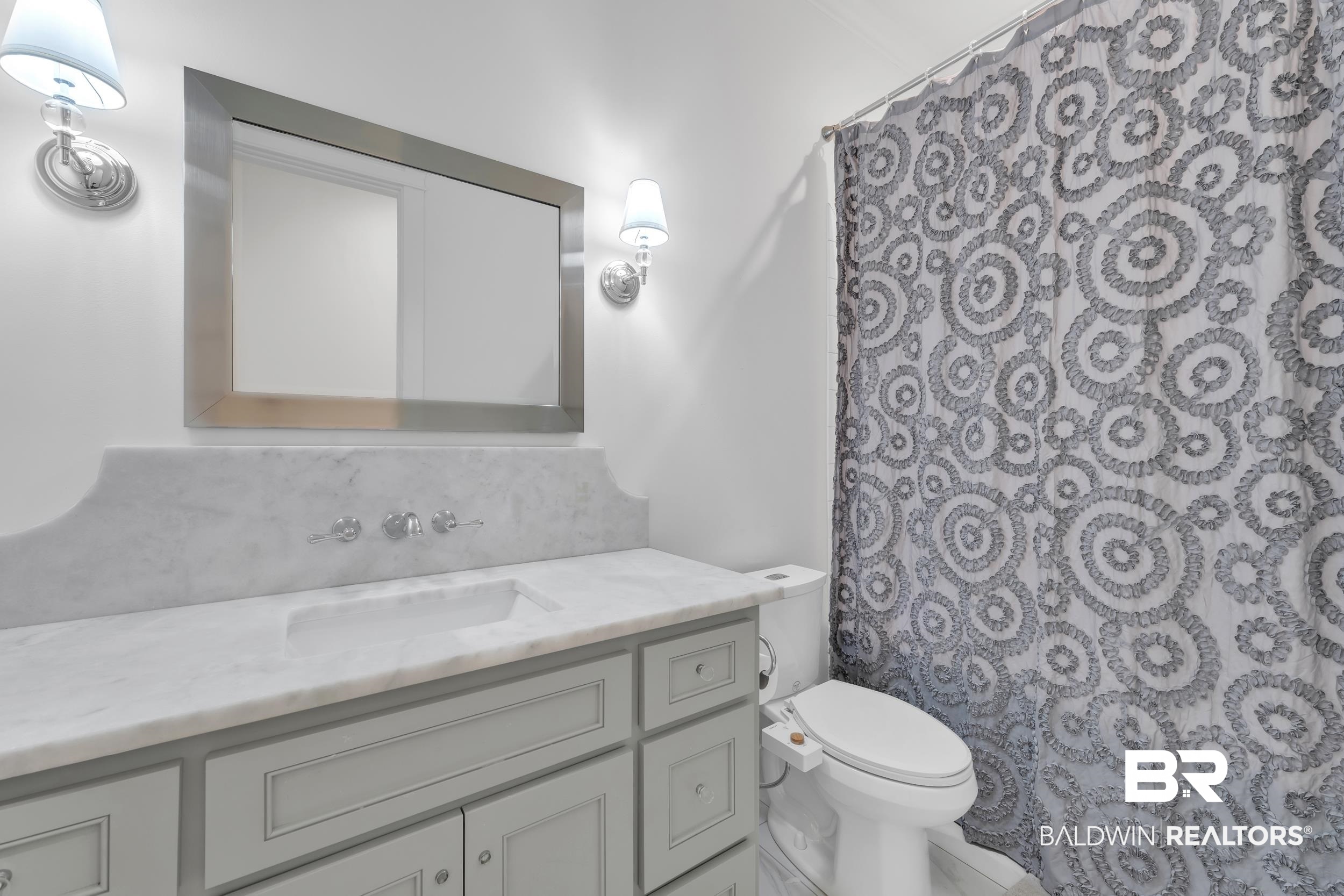 14531 Styx River Road Stapleton, AL 36578 - Photo 26 of 50 Bathroom featuring vanity, toilet, and a shower with curtain