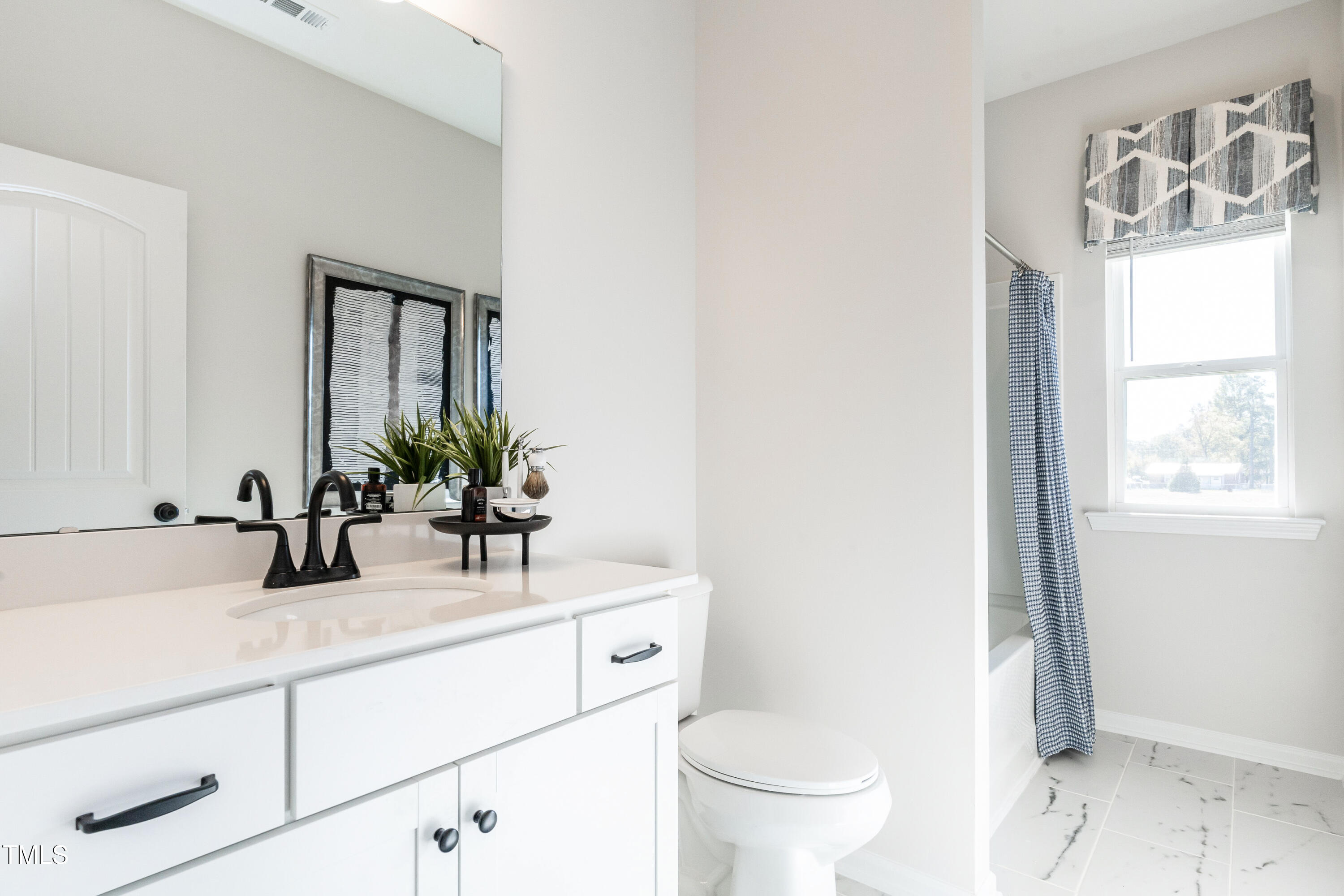 306 Deodora Lane Cameron, NC 28326 - Photo 22 of 27 a bathroom with a sink and a mirror