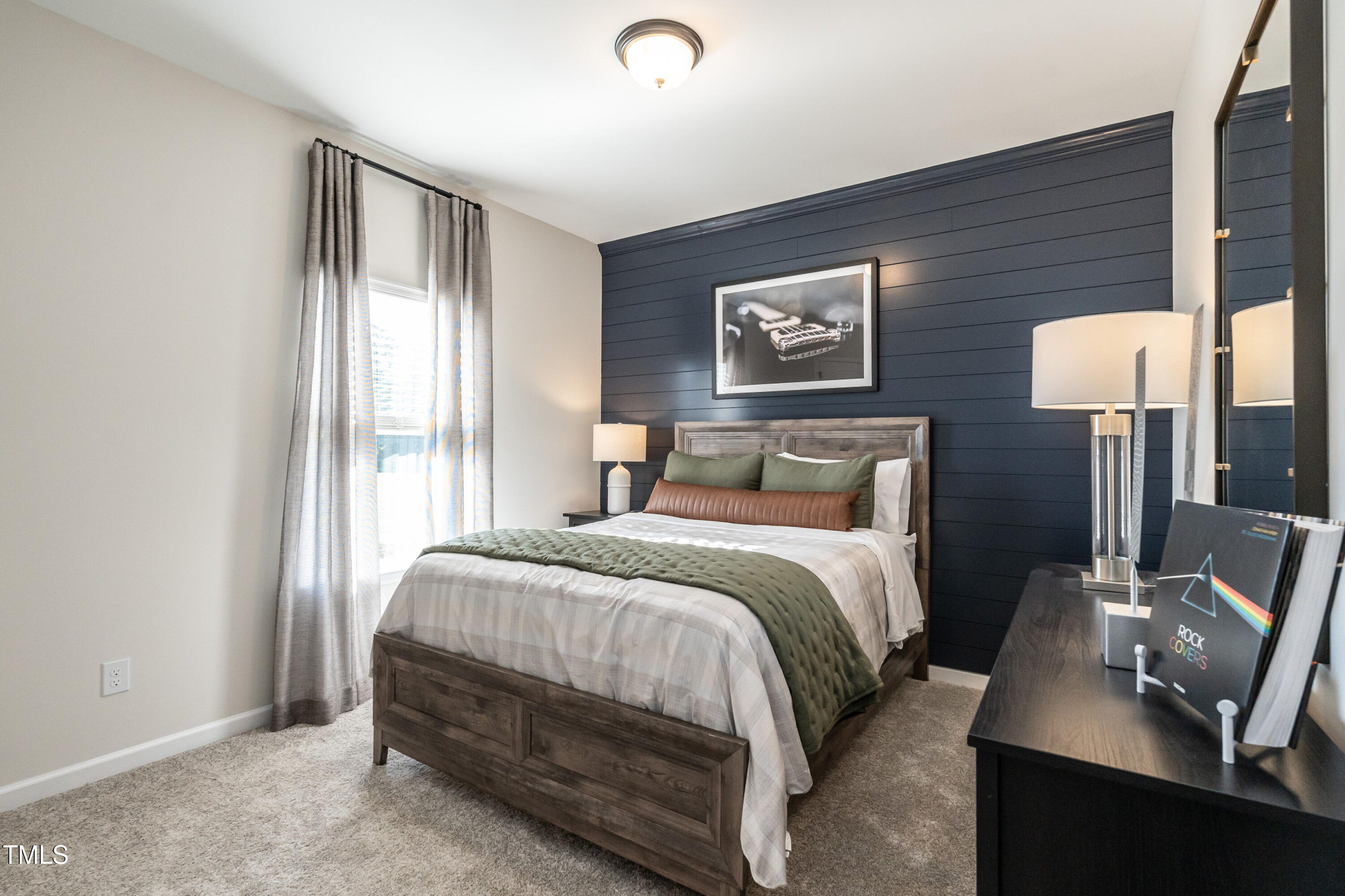 306 Deodora Lane Cameron, NC 28326 - Photo 23 of 27 a bedroom with a bed and a lamp on table