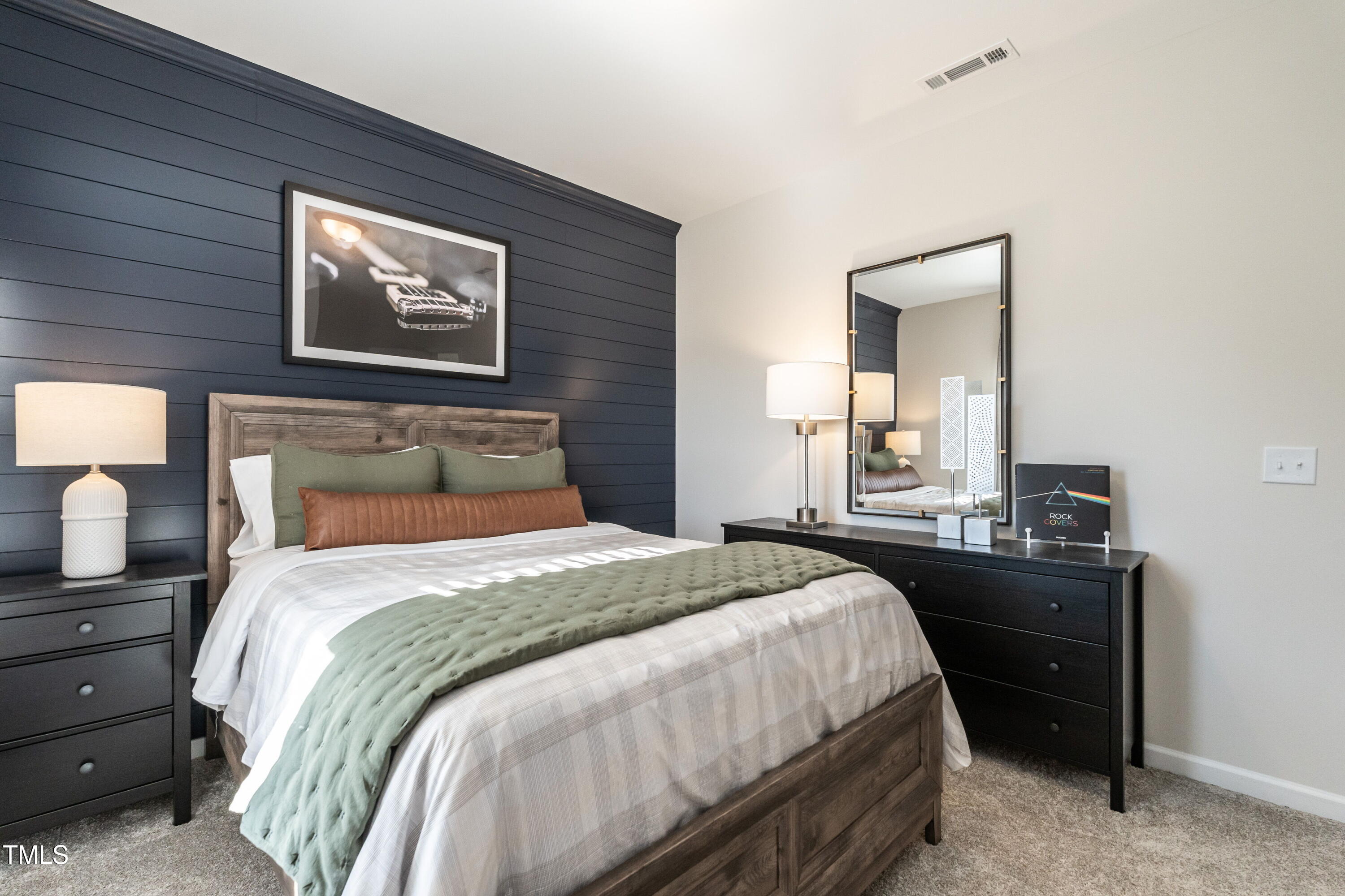 306 Deodora Lane Cameron, NC 28326 - Photo 24 of 27 a bedroom with a bed and a lamp on dresser