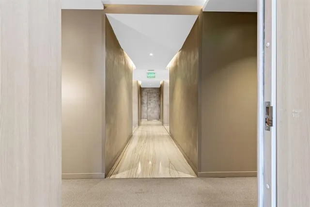 a view of gallery with wooden floor